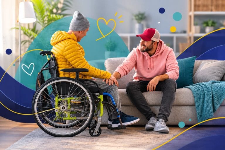 Two people sitting together in a home setting, with one person using a wheelchair, representing care and practical support for people living with MND.